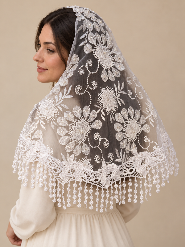 Woman wearing the white beaded floral lace prayer veil