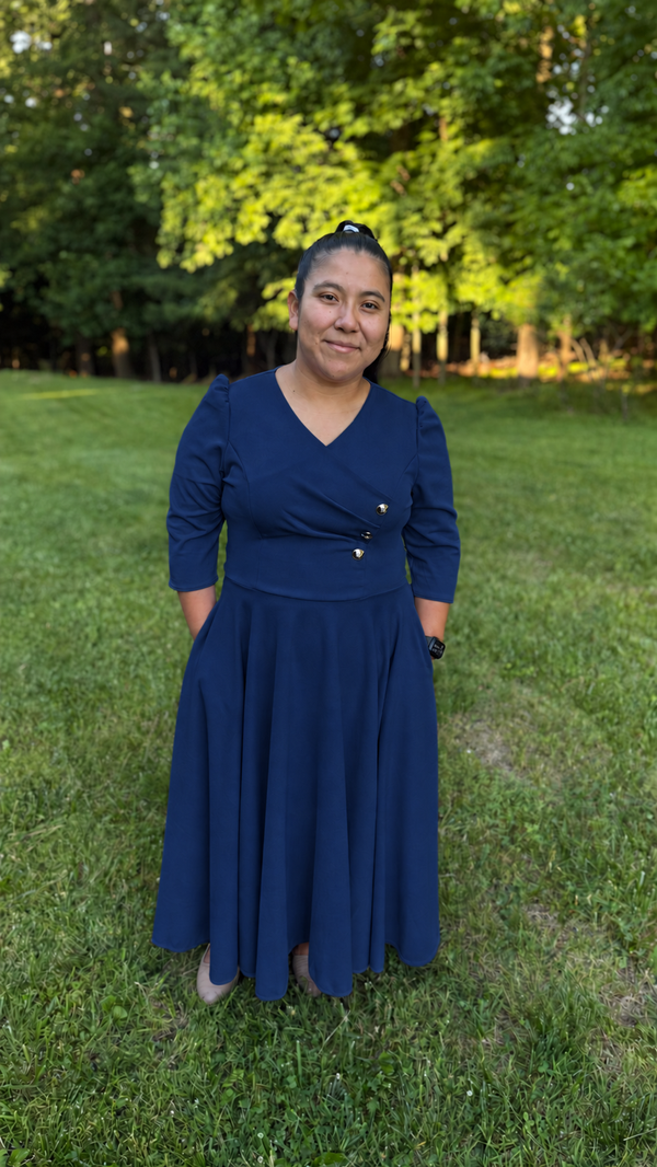 Navy modest wrap-style maxi dress with three-quarter sleeves and jewel buttons